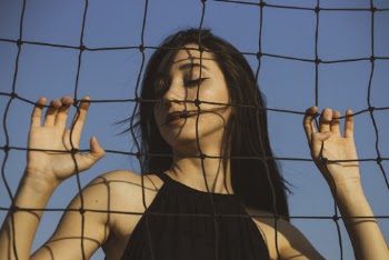 Woman in Black Sleeveless Top