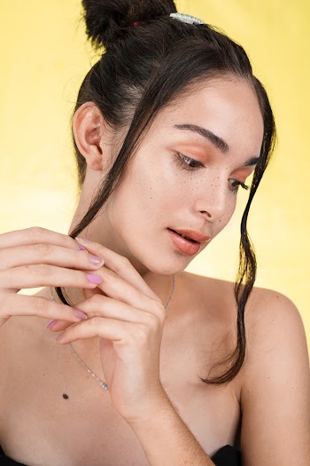 Woman in Black Spaghetti Strap Top Looking Down