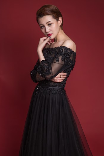 Woman in Black Strapless Dress Posing 