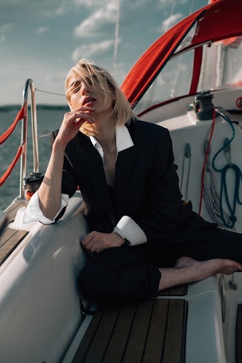 Woman in Black Suit Blazer In A Yacht