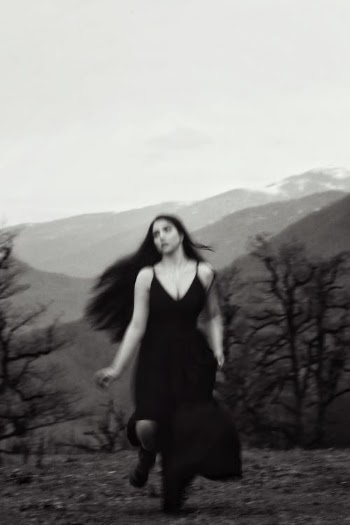 Woman in Black Tank Top Standing Near Bare Tree · Free Stock Photo
