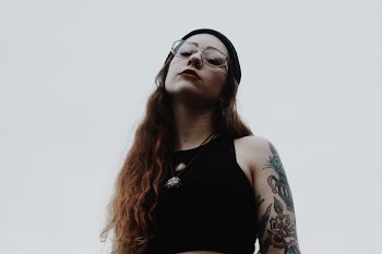 woman in black tank top wearing eyeglasses