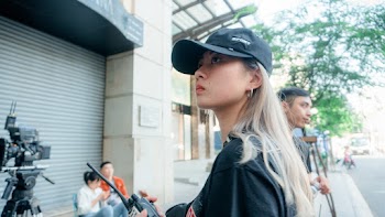 Woman in Black Top and Black Cap