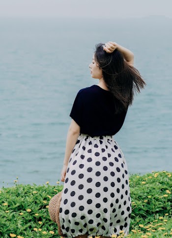 Woman In Black Top and Black Skirt