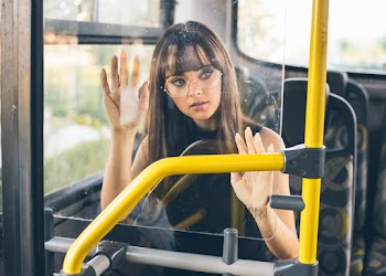 Woman in Black Top Sleeveless Top Riding on Vehicle
