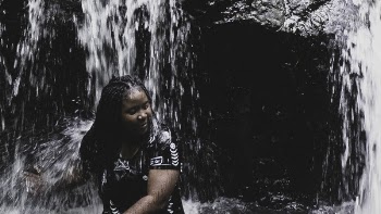Woman in Black Top Soothing on Fountain