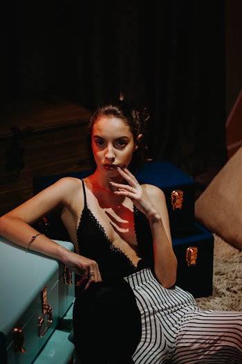 Woman In Black Top Wearing White Bottoms