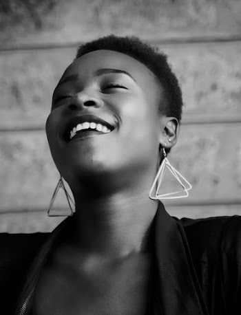 Woman in Black Top With Dangle Earrings