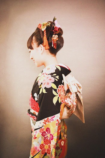 Woman in Black Yellow and Red Floral Kimuno Dress