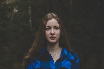 Woman in Blue and Black Plaid Button-up Shirt