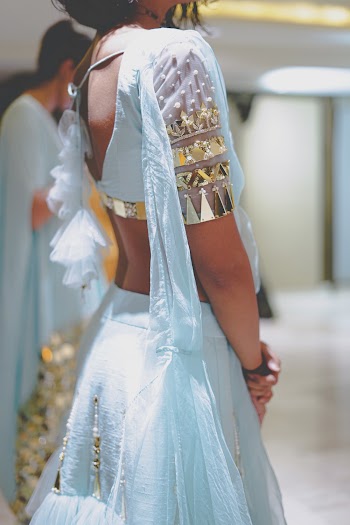 Woman in Blue and Gold Crop Top and Skirt