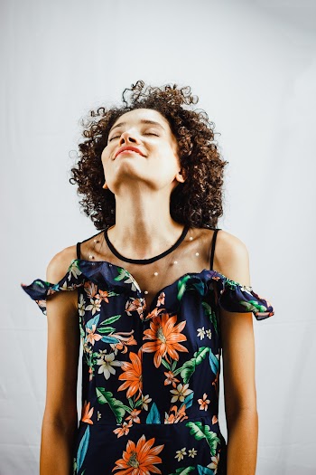 Woman in Blue and Red Floral Dress