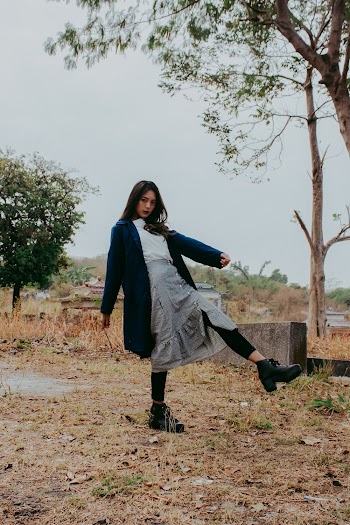Woman in Blue Blazer Standing Beside Tree