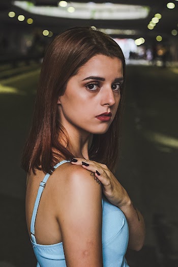 Woman in Blue Cami Top Looking Back