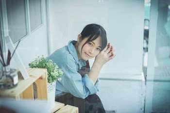 Woman in Blue Collared Top Posing for Photo