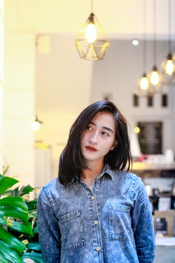 Woman in Blue Denim Button-up Jacket