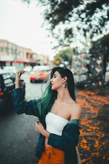 Woman in Blue Denim Jacket and White Crop Top