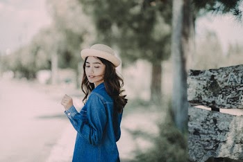 Woman in Blue Denim Jacket Standing Outdoors