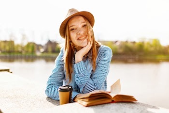 Woman in Blue Dress Shirt Smiling