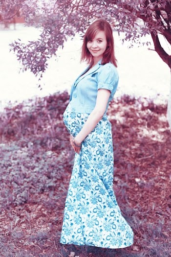 Woman in Blue Maternity Coat and White and Blue Floral Maternity Dress