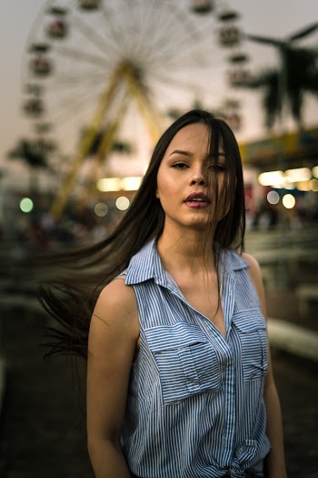 Woman in Blue Sleeveless Blouse