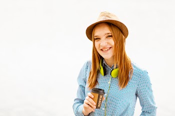 Woman in Blue Striped Button-up Long-sleeved Shirt and Brown Hat
