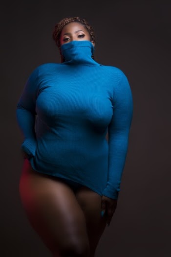 Woman in Blue Turtleneck Sweatshirt