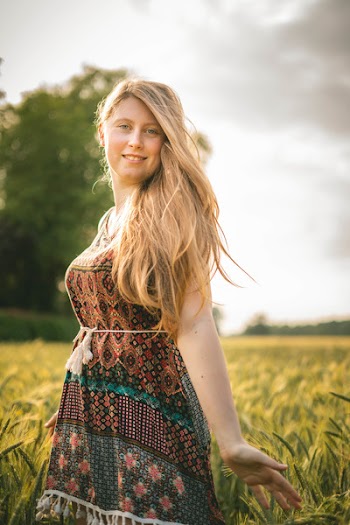 Woman in Brown-and-blue Dress Standing in Wheat Field