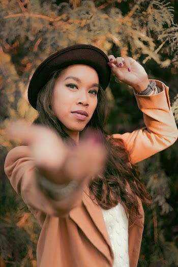 Woman in Brown Blazer and Hat