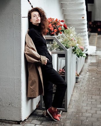 Woman in Brown Coat and Black Pants