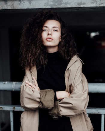 Woman in Brown Jacket and Black Shirt
