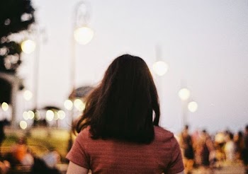woman in brown T-shirt in shallow focus photography