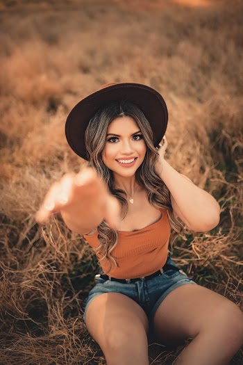 Woman In Brown Tank Top With Hand Reaching Out