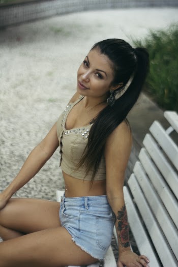 Woman In Crop Top And Blue Denim Shorts