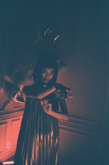 Woman in Dark Room