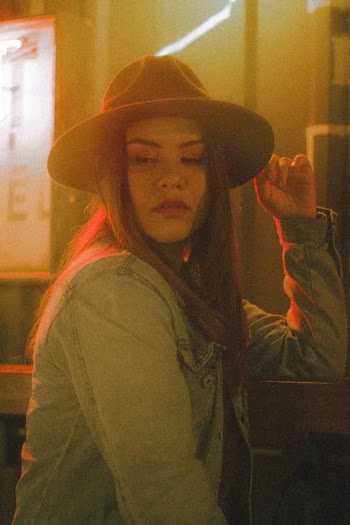 Woman in Denim Jacket Wearing a Brown Hat · Free Stock Photo