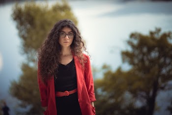 Woman in Eyeglasses Wearing Red Coat