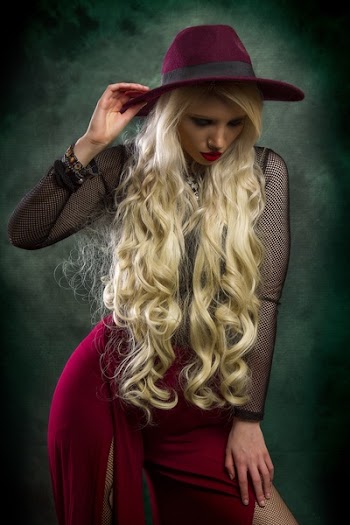 Woman in Fashionable Dress Posing for Photo