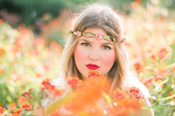 Woman in Flower Field Wearing Headband