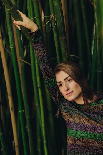 Woman in Front Bamboo Plants