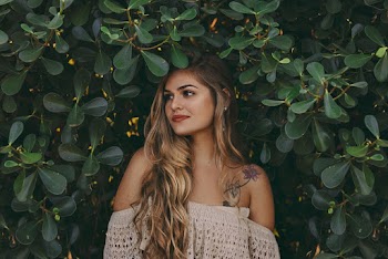 Woman in Front Bushes