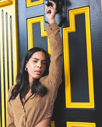 Woman in Front  Of A Wooden Door