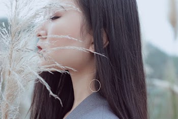 Woman In Front of Grass