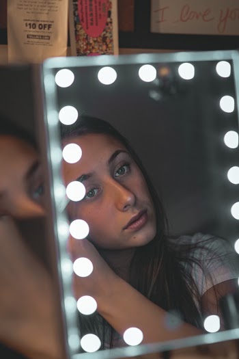Woman in Front of Vanity Mirror