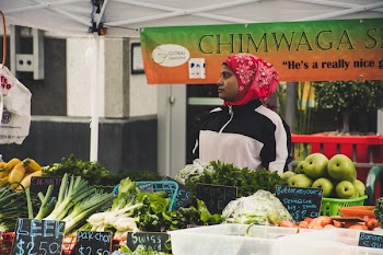 Woman in Front of Vegetables