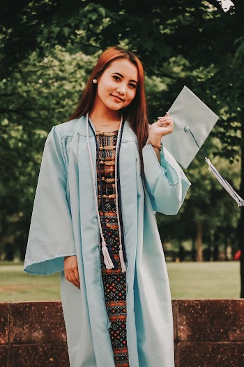 Woman in Graduation Gown Smiling