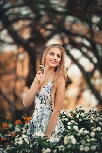 Woman In Gray and White Floral Spaghetti-strap Dress