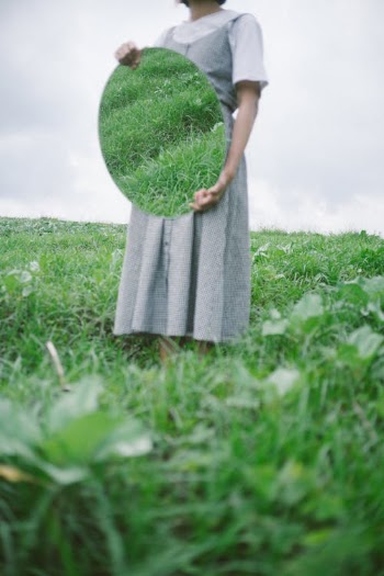 Woman in Gray Dress Standing on Green Grass Field · Free Stock Photo
