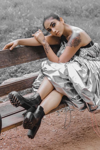 Woman in Gray Silk Tube Dress and Black Boots