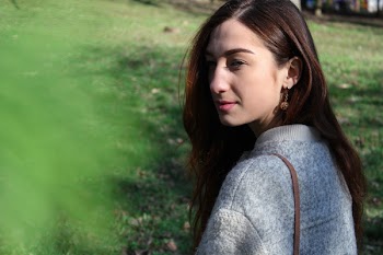 Woman in Gray Sweater Beside Grass Field